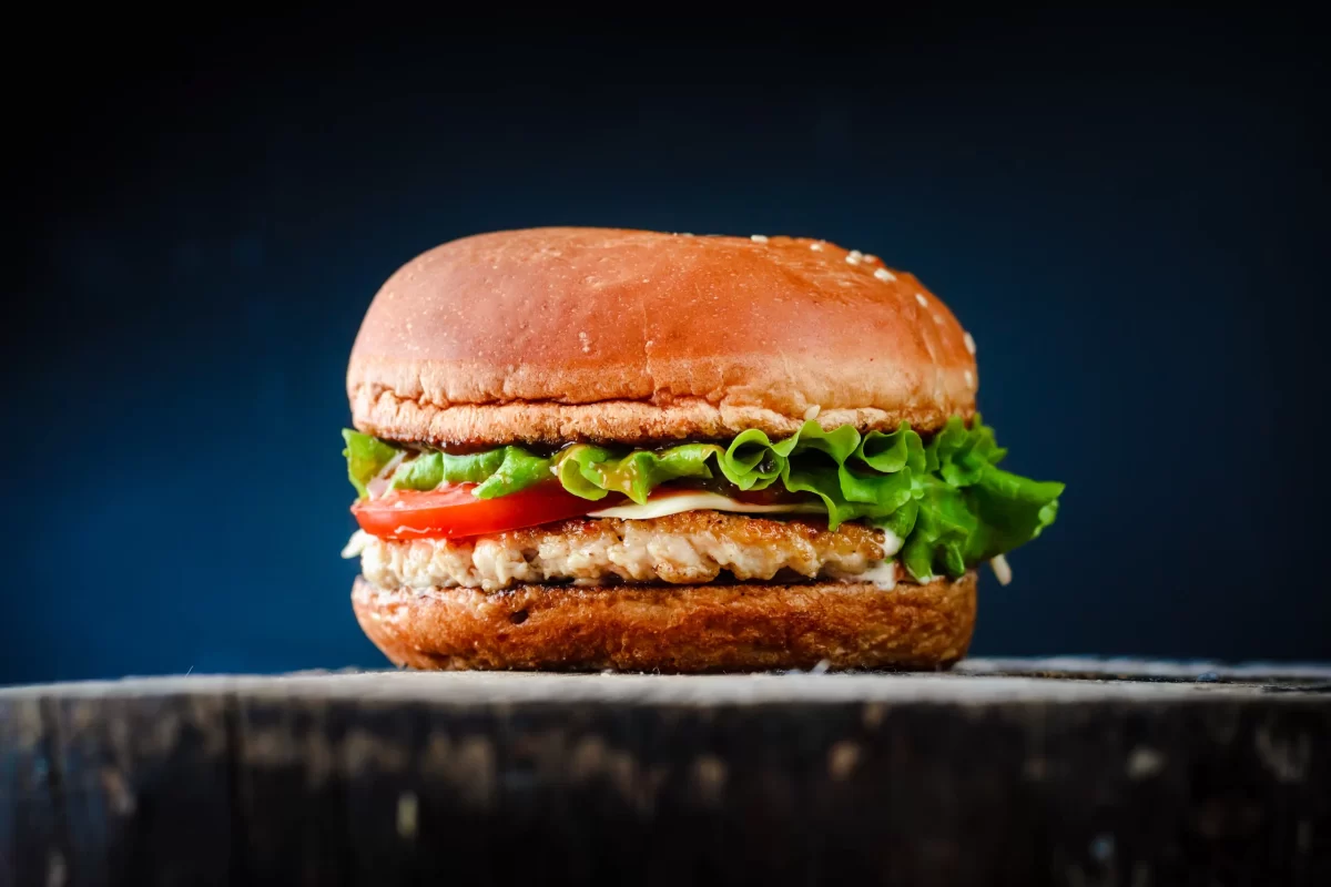 homemade-appetizing-chickenburger-black-background